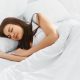 Attractive young woman sleeping in bedroom. Healthy lifestyle. Wellness concept