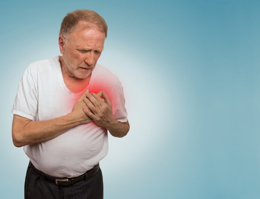 senior man suffering from bad pain in his chest